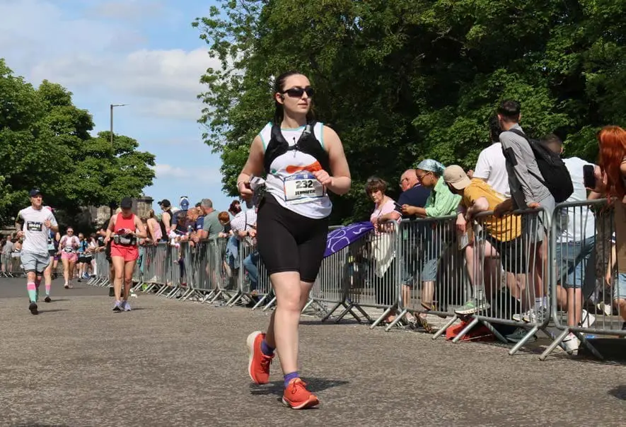 A supporter taking part in a running event